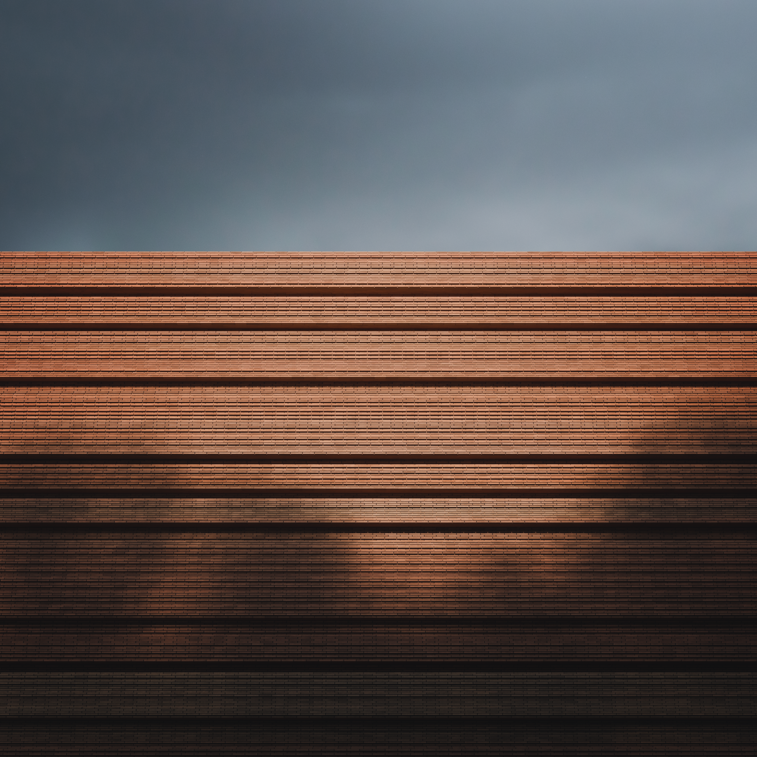red brick of the New Collection Centre for Hungarian Museum of Natural History set against a blue sky