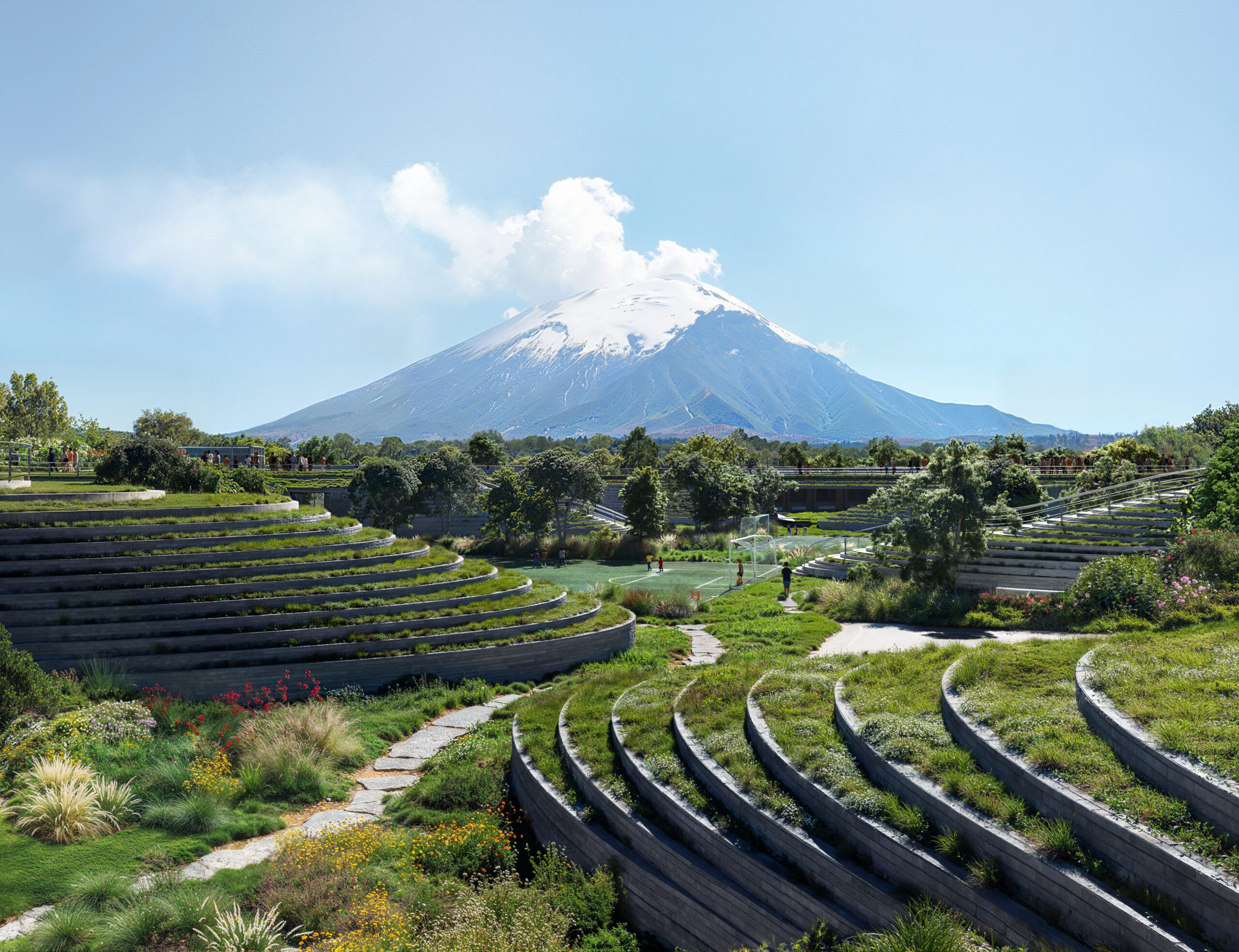 Render of terraced landscape and sports pitch at Canadian School, Cholula, with Popocatépetl volcano beyond. Contemporary educational architecture in Mexico by Sordo Madaleno.