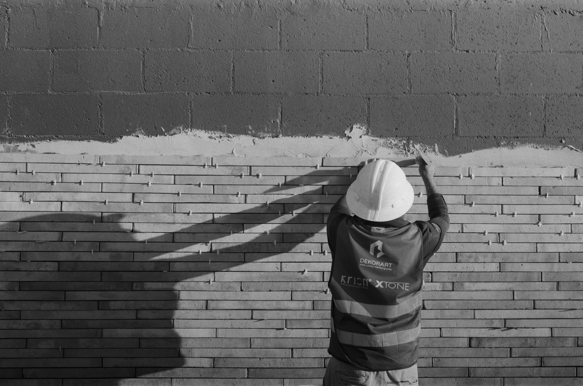 construction worker laying bricks