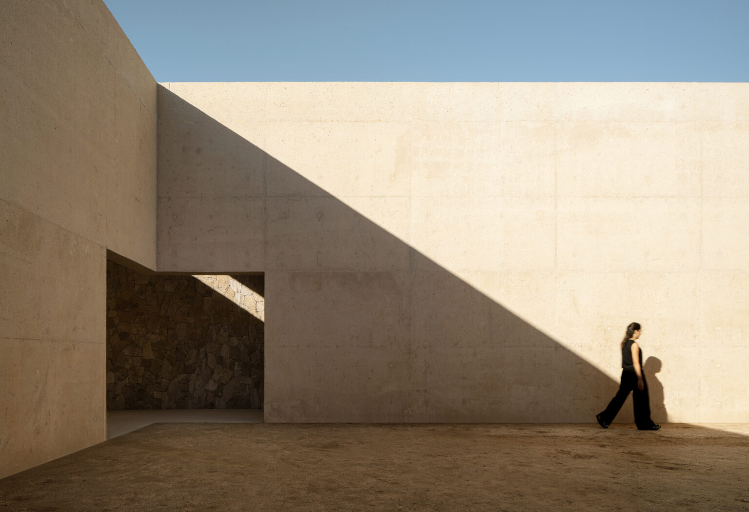 Sordo Madaleno — Diagonal shadow cast across minimalist stone and plaster walls at Arte Abierto Baja, Los Cabos. By Sordo Madaleno.