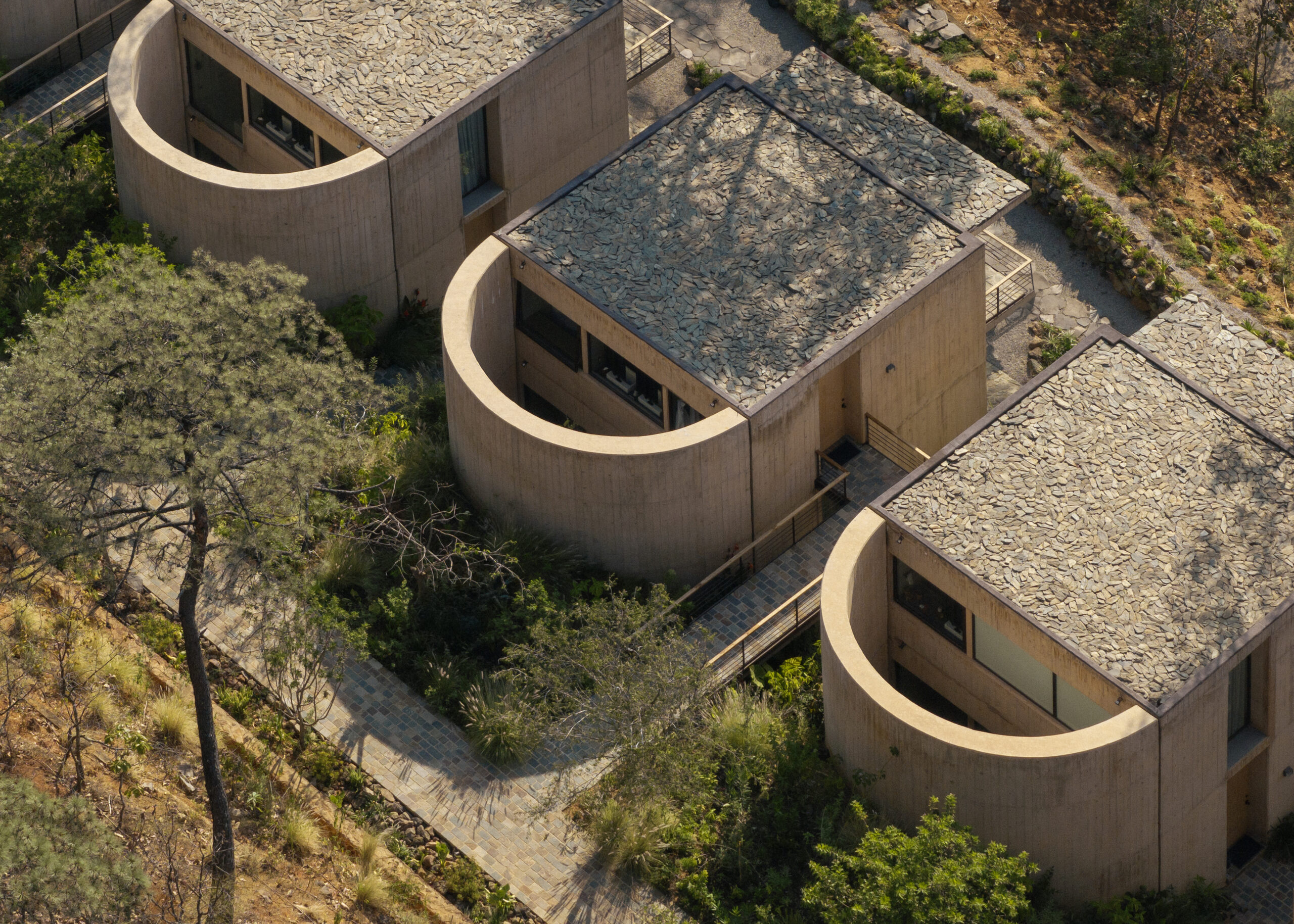 Rancho del Bosque by Sordo Madaleno, a house in Valle de Bravo composed of concrete pavilions that extend into the mountain landscape and frame views of the surrounding forest.