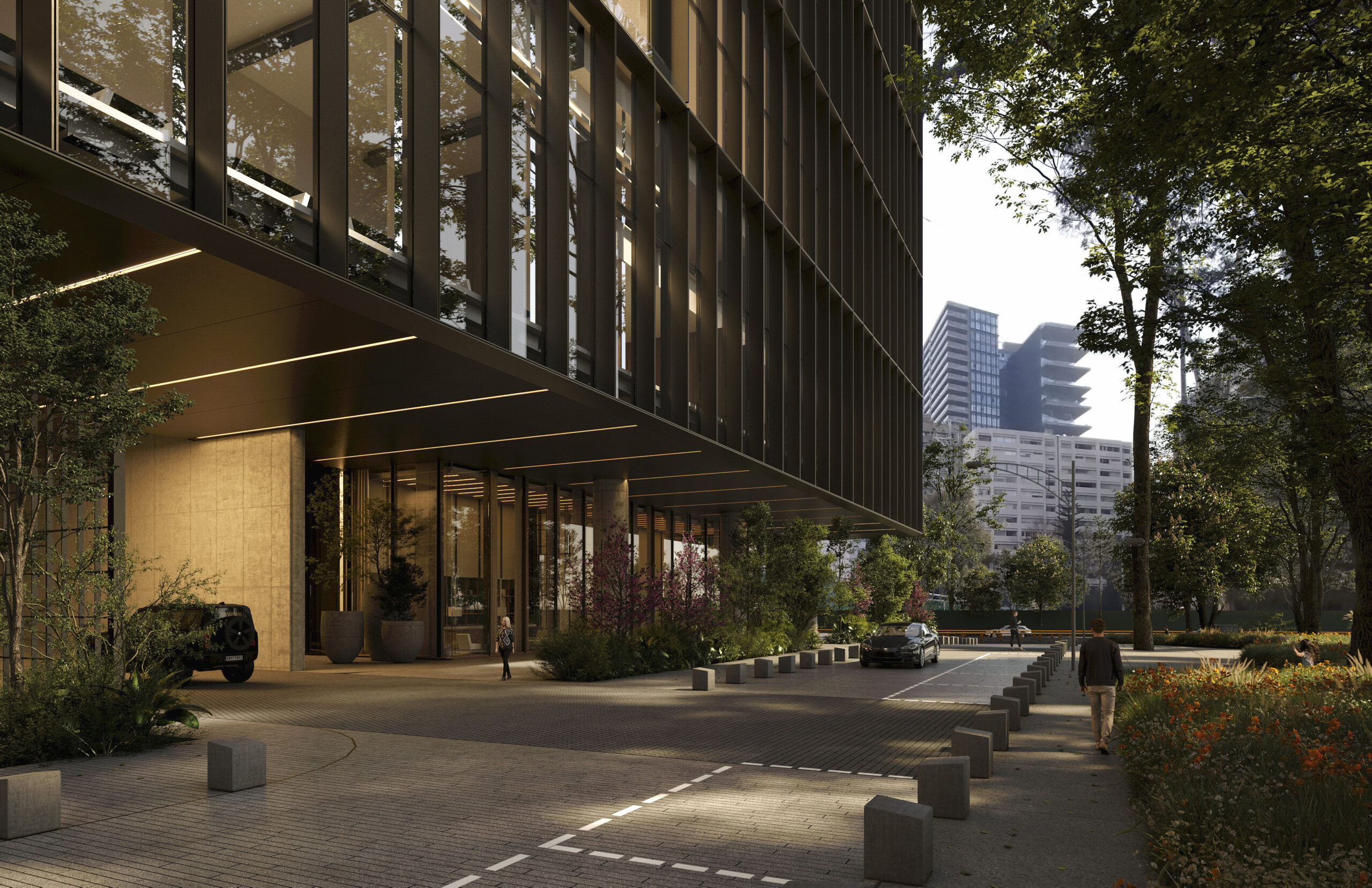 Vista exterior de la entrada principal del Park Hyatt Mexico City, que destaca por su marquesina en voladizo, Piedra cálido Piedra y su fachada de lamas oscuras, flanqueada por una exuberante vegetación.