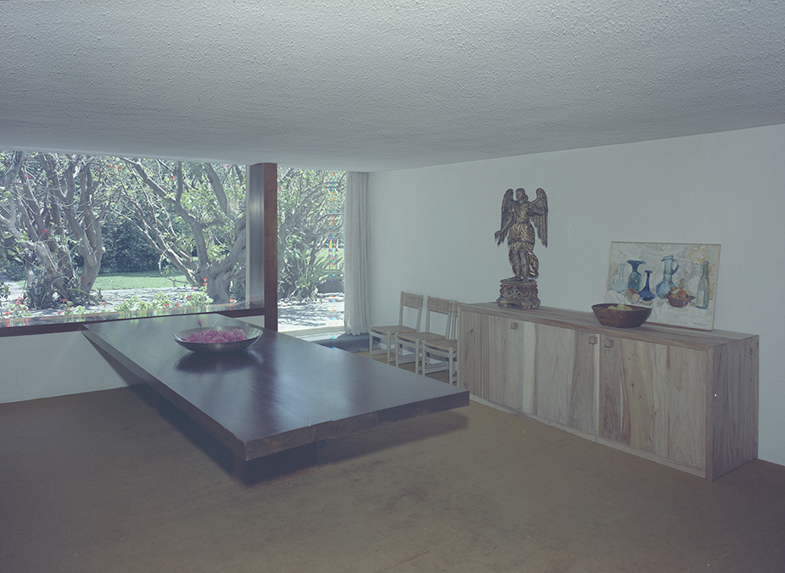 Juan Sordo Madaleno's dining table at Casa Lomas — a singular horizontal plane held low against the landscape — laid the groundwork for the studio desks that define the practice's working environment across generations.