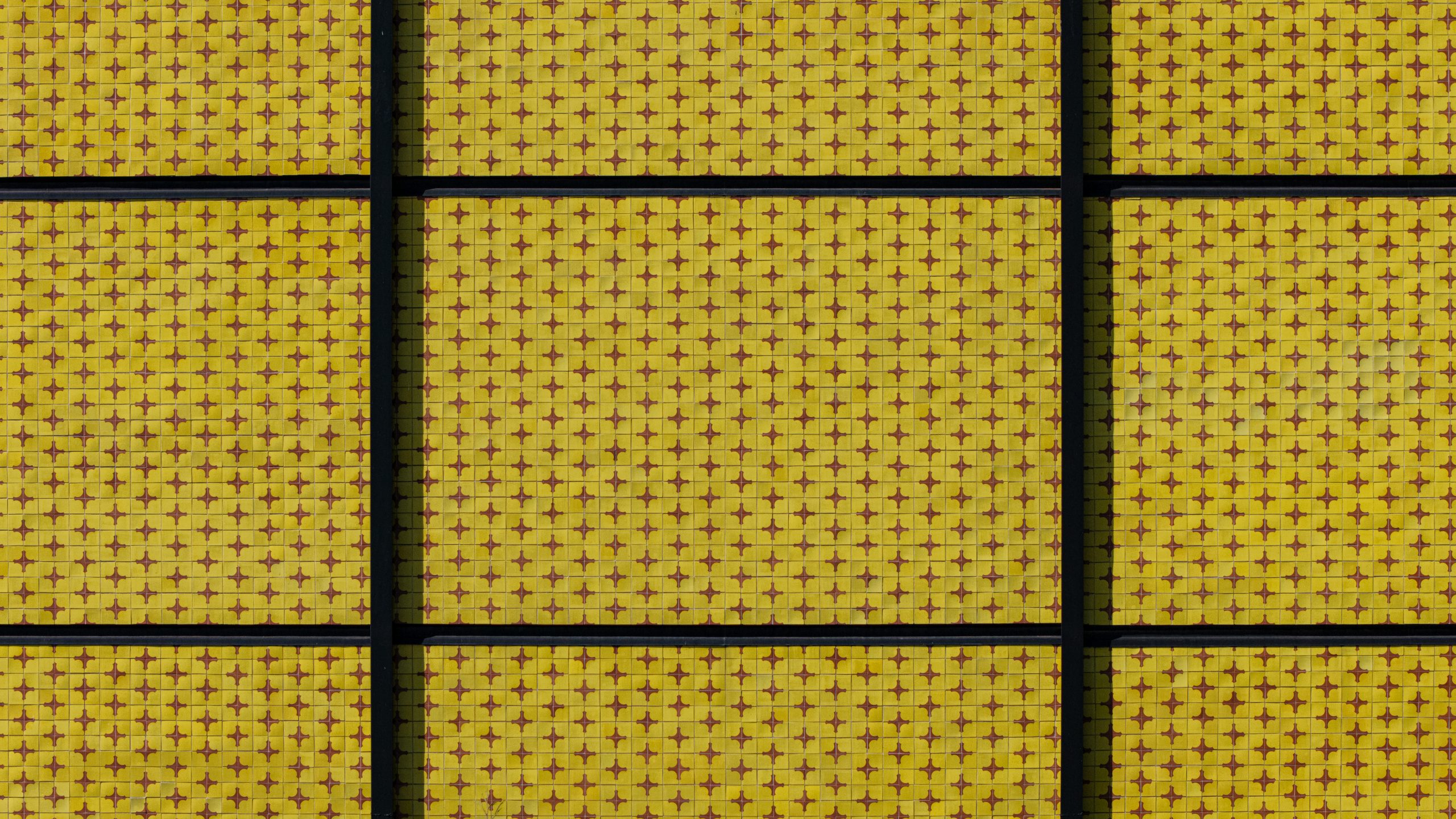 Close-up of handmade yellow ceramic tile cladding on San Ignacio de Loyola Church façade, Polanco, Mexico City. Juan Sordo Madaleno, 1961.