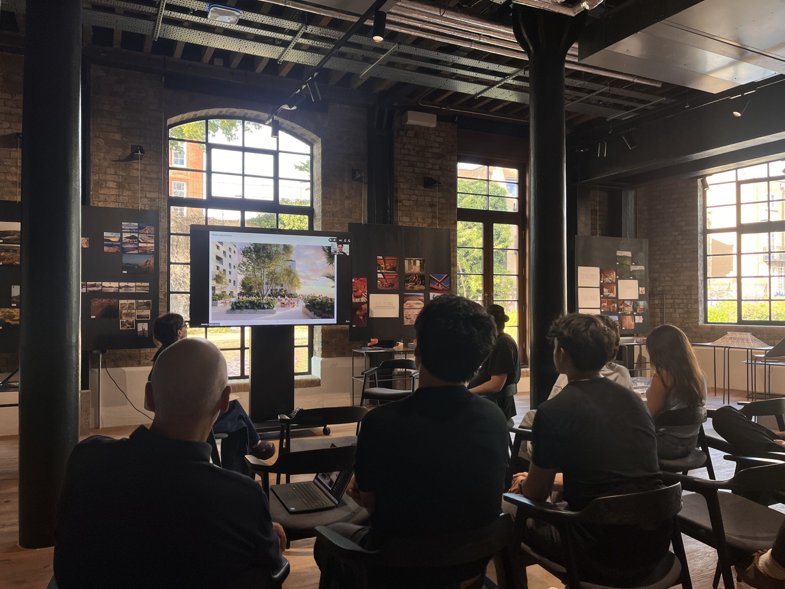 Sordo Madaleno's London studio team reviewing a courtyard render for the Panama project during a Live Journal session